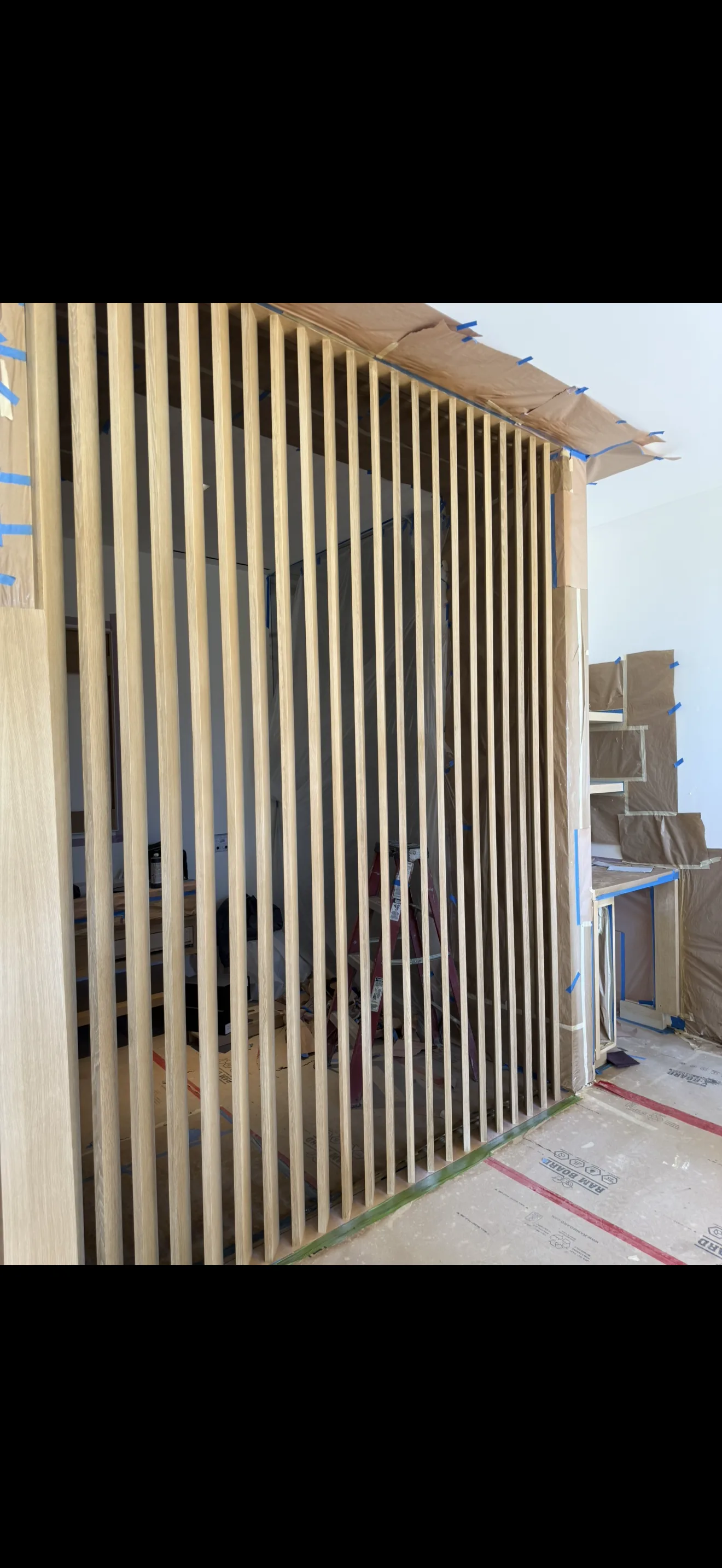 Detailed wood slat wall during finish work